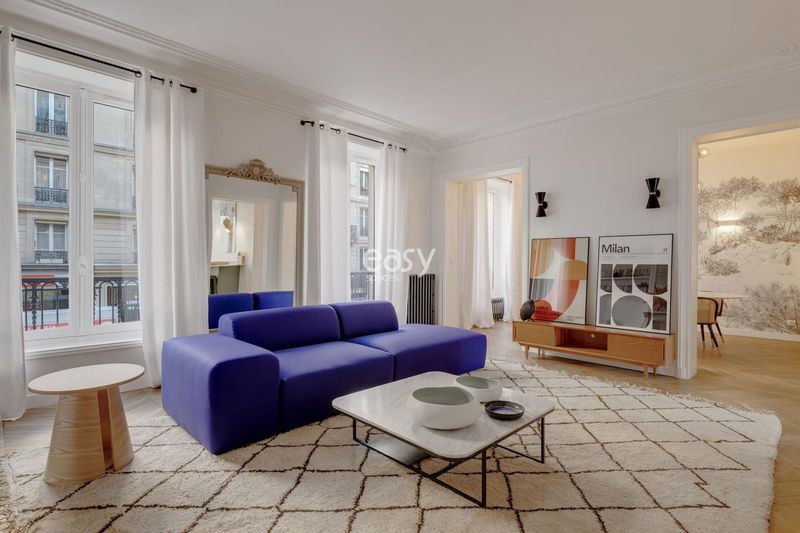 Filming location in a classic Haussmann-style apartment featuring parquet floors and intricate moldings in Paris, FRANCE
