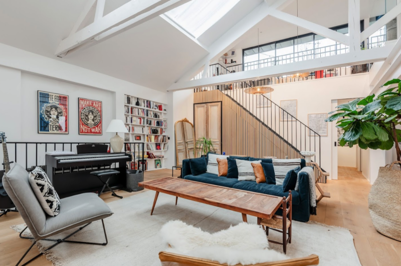Double-height living room with open mezzanine and glass roof, Paris loft filming location for high-end productions | Easy Spaces