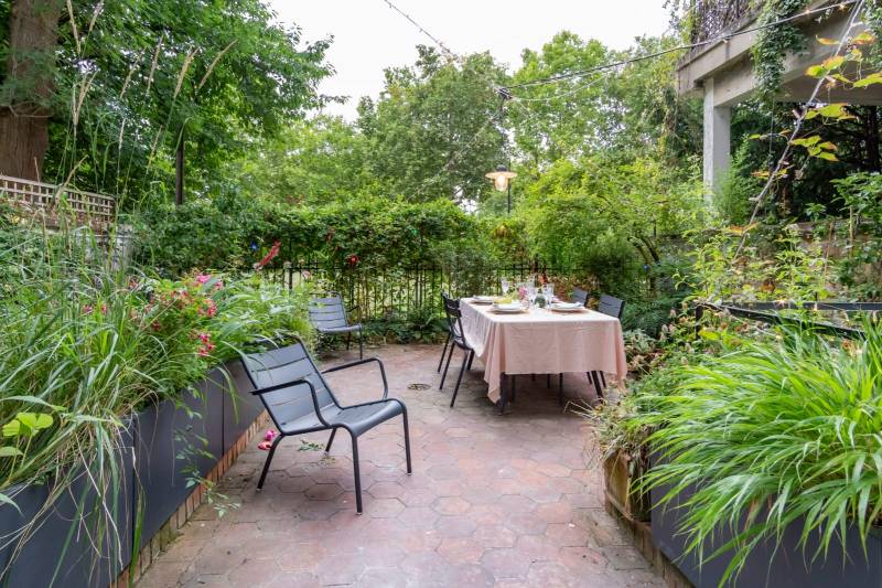 apartment with wooden flooring and decorative moldings including a private garden perfect for filming in Paris, FRANCE