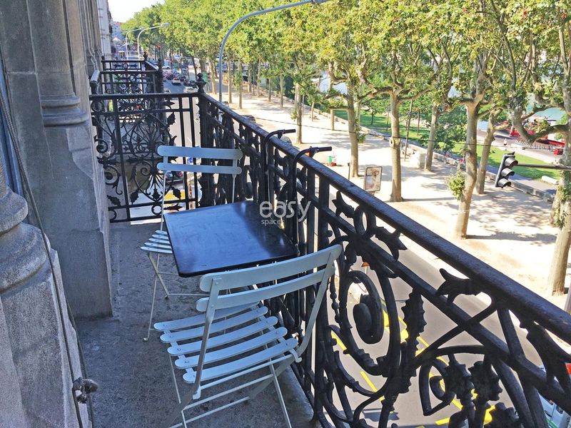 decorated scene featuring a balcony overlooking the city of Lyon